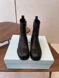 PRADA 25S COWBOY BOOTS IN RK BLACK-BROWN CALFSKIN