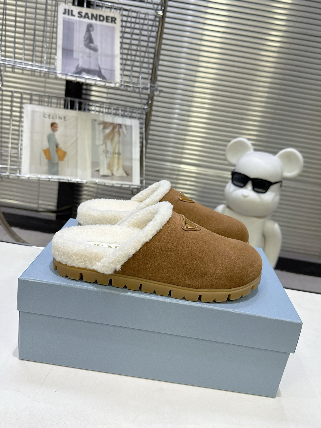 PRADA 25S FUR-LINED MULES IN BROWN SUEDE