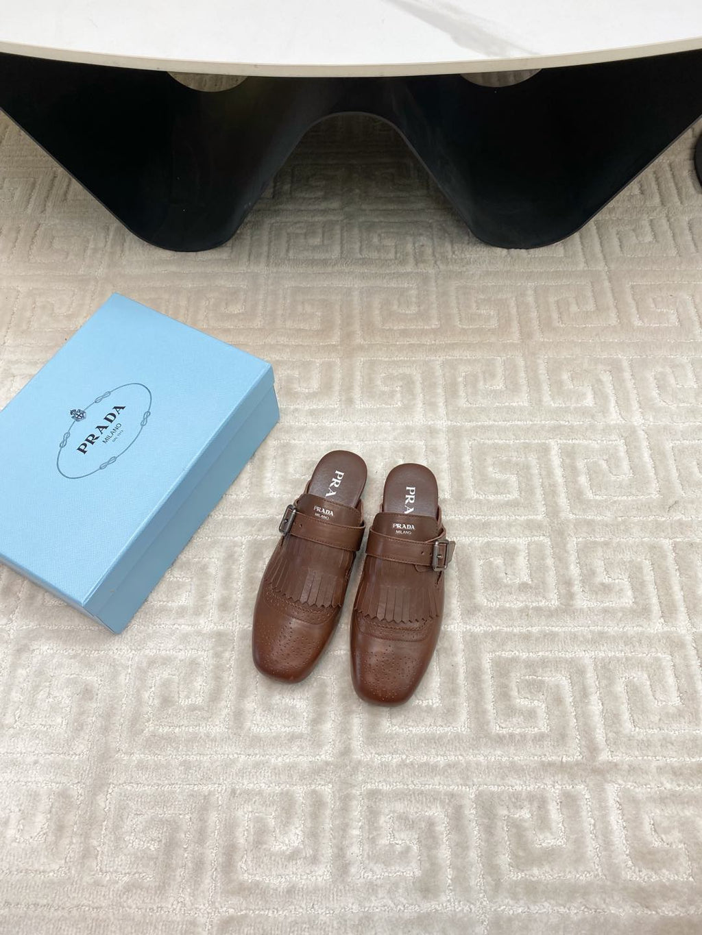 PRADA TASSEL MULES IN RUSSET BROWN LAMBSKIN