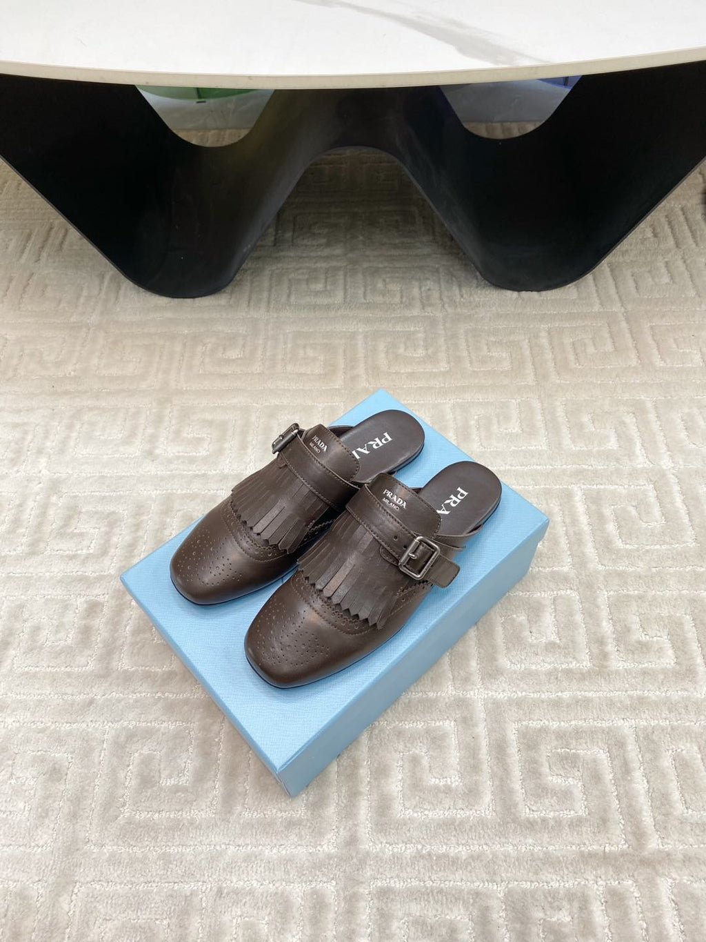 PRADA TASSEL MULES IN WALNUT BROWN LAMBSKIN