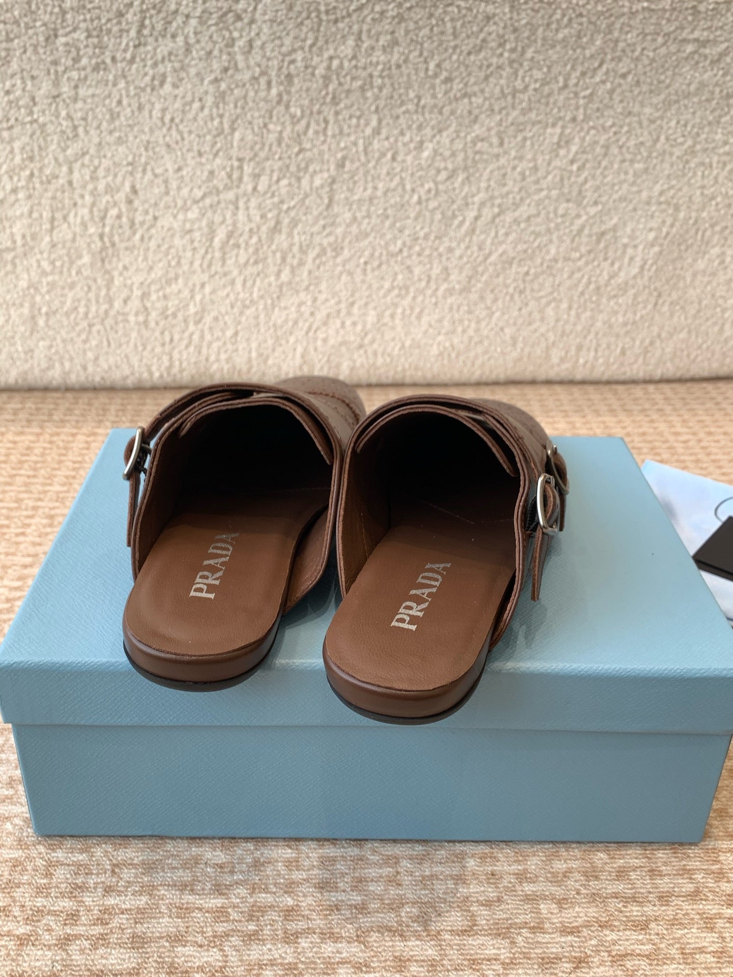 PRADA DOUBLE MONK MULES IN RK BROWN CALFSKIN
